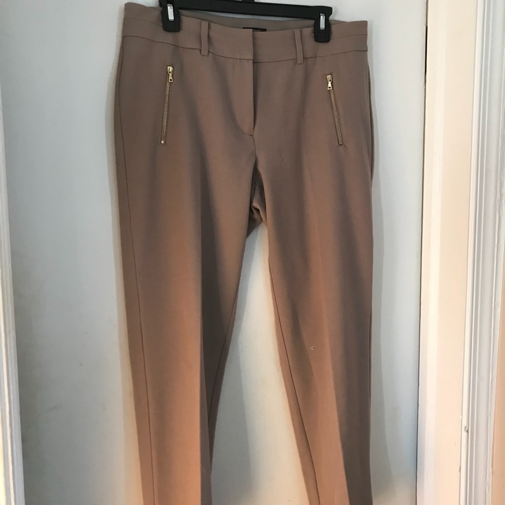 Tan slacks with gold zipper pockets